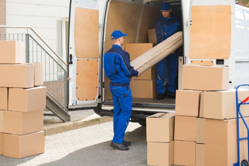 Removals van ready for a Chelsea residential move near elegant townhouses