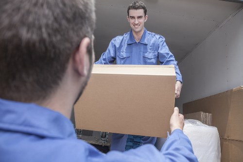 Furniture and boxes being loaded into a removals van in Chelsea