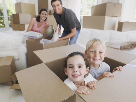 Moving boxes and packing supplies arranged for a Chelsea home relocation
