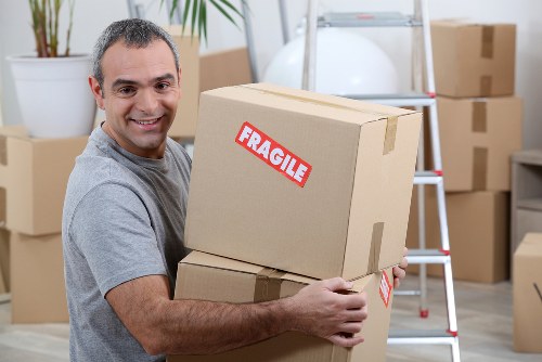 Man with van service moving boxes in Chelsea street