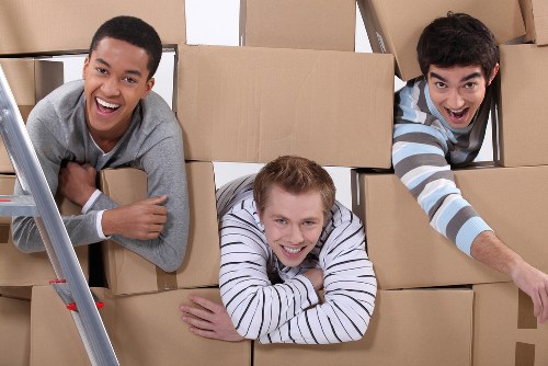 Removal team preparing for a Chelsea home move near local townhouses