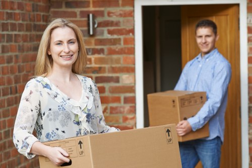 Trained moving staff using correct lifting techniques and PPE