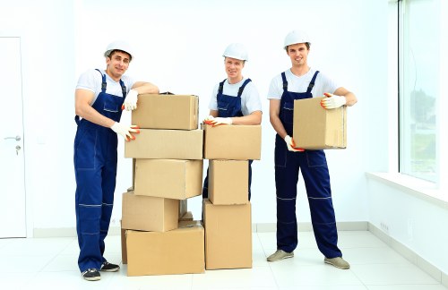 Professional man and van team transporting office equipment in Chelsea