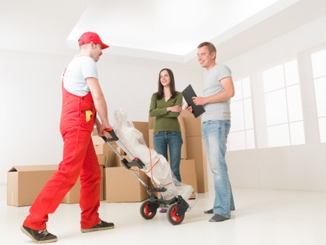 Loading furniture into a man and van in Chelsea