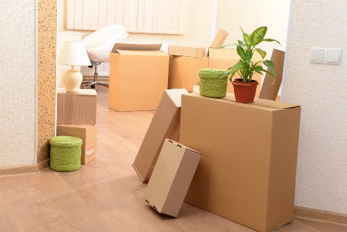 Local movers transporting belongings through a Chelsea street