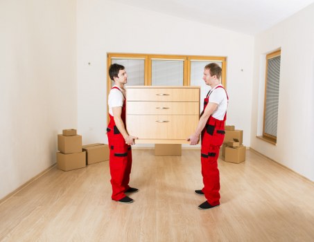 Professional movers loading furniture for a Chelsea relocation